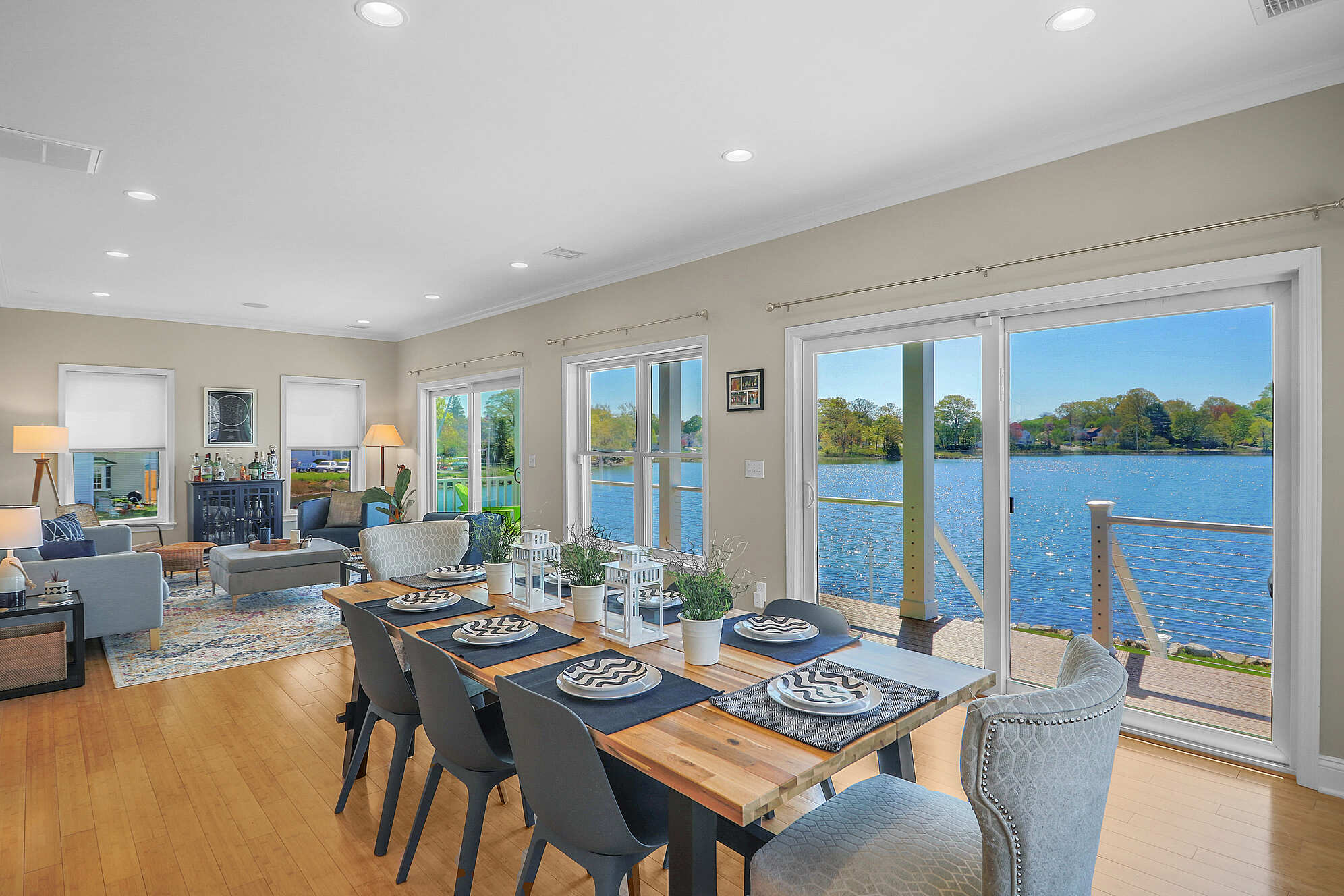 remodeled home on water with kitchen table and chairs by Raymond Design Builders in Fairfield County, Connecticut