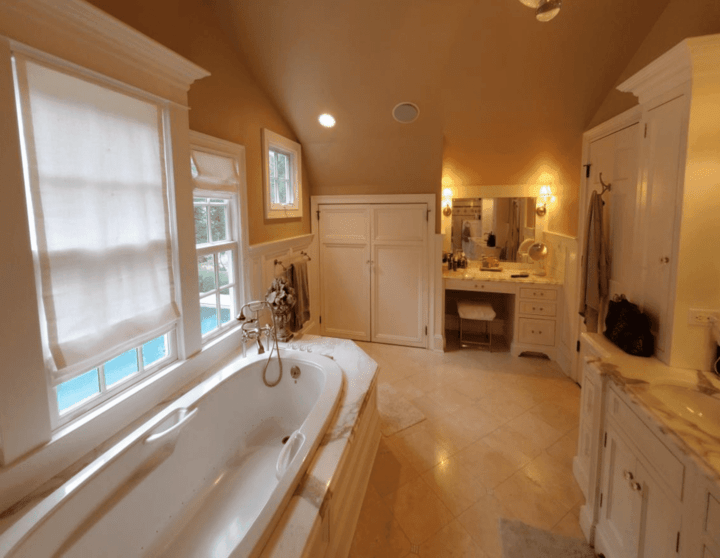 remodeled bathroom with tan tile in Fairfield County Connecticut by Raymond Design Builders