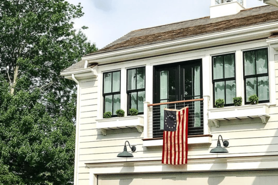 remodeled home with flag by Raymond Design Builders in Fairfield County, CT