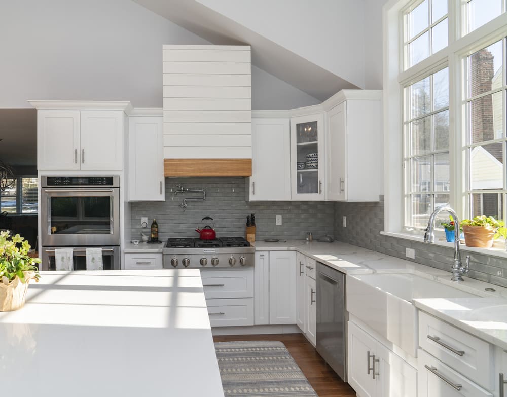 white kitchen island and large window above sink in fairfield