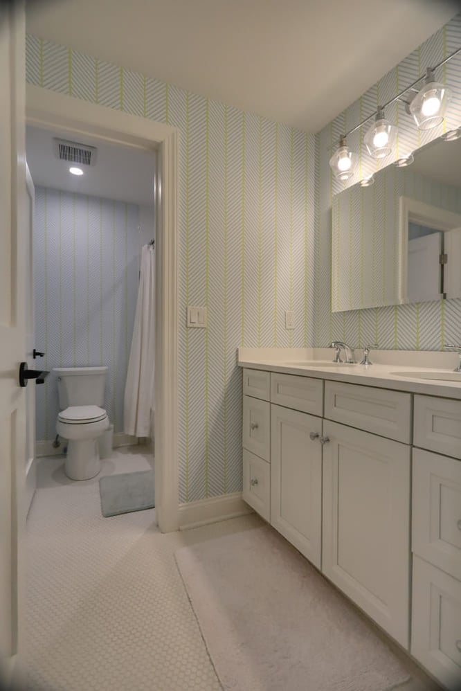 blue and green striped walls in bathroom by raymond design builders in ct