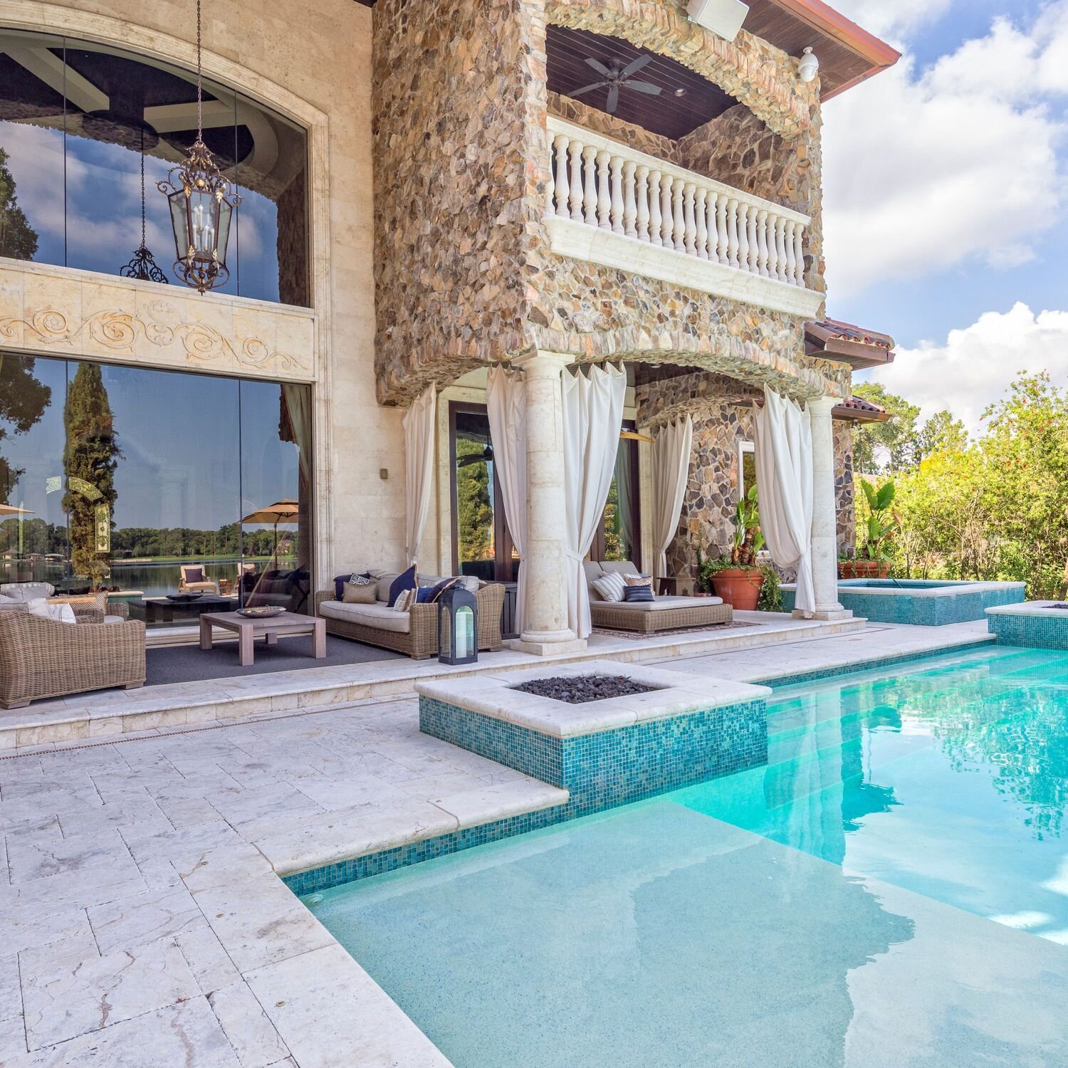 large blue outdoor furniture in backyard with inground pool - outdoor living