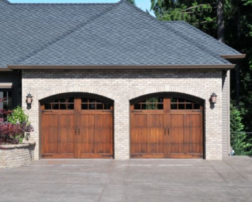 luxury two car garage made out of wood by Raymond Design Builders in Fairfield County, Connecticut