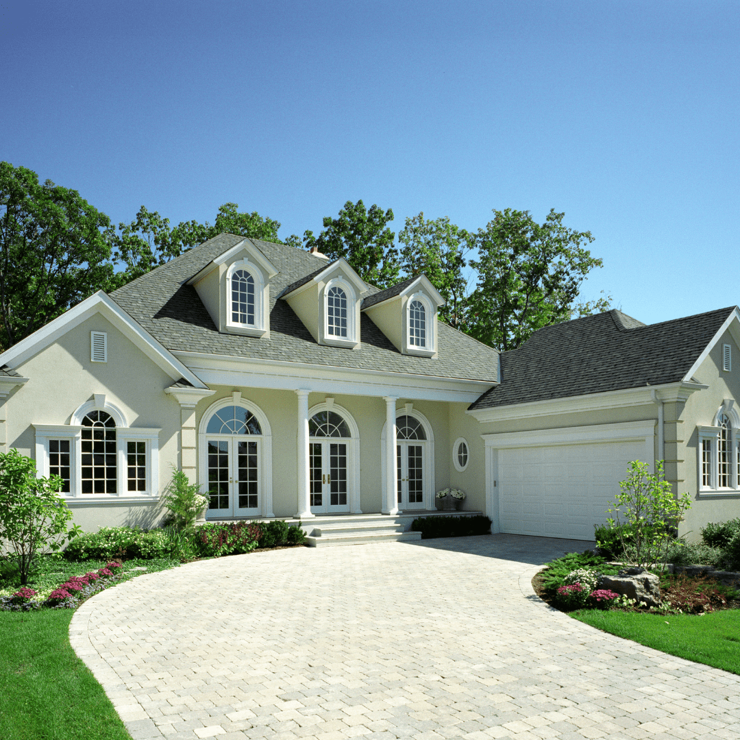 white house with white garage and driveway by Raymond Design Builders in Fairfield County, CT