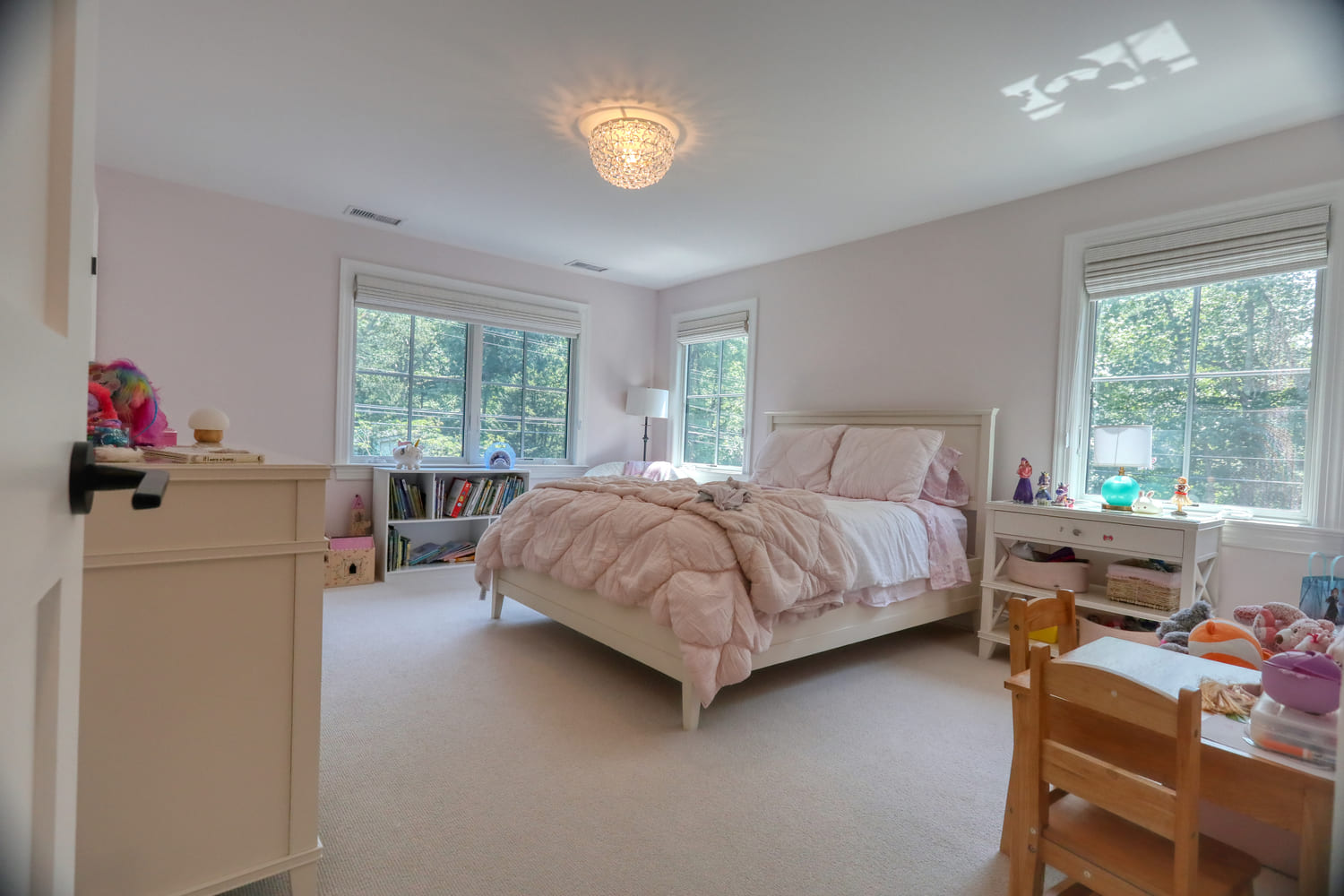 pink and white childrens bedroom by raymond design builders in ct