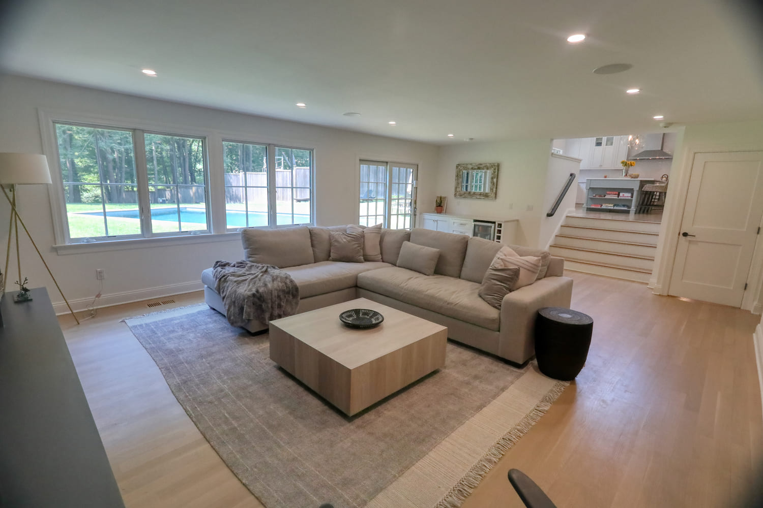 white couch in modern living room by raymond design builders in ct