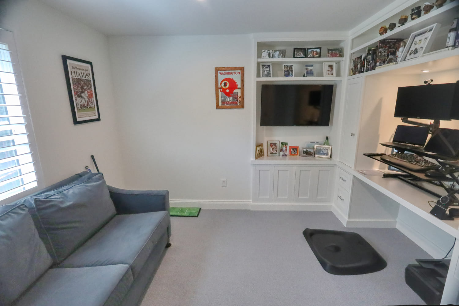 white modern office with built in shelving and desk by raymond design builders in ct