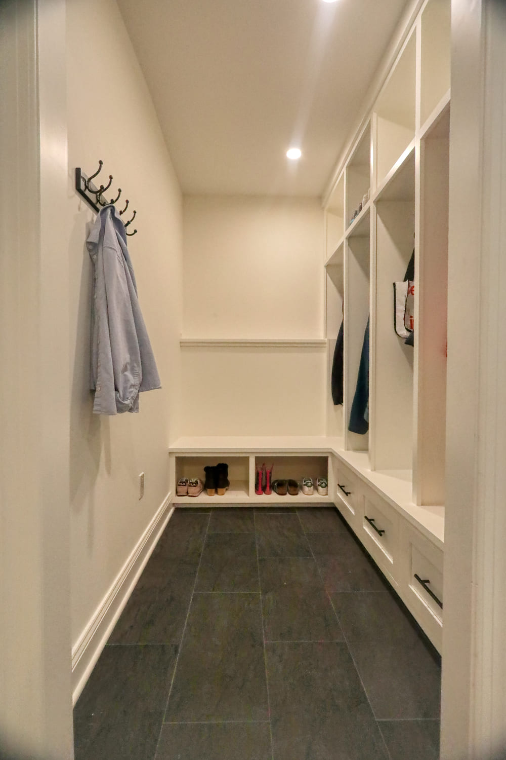 white mudroom with extra storage space by raymond design builders in westport