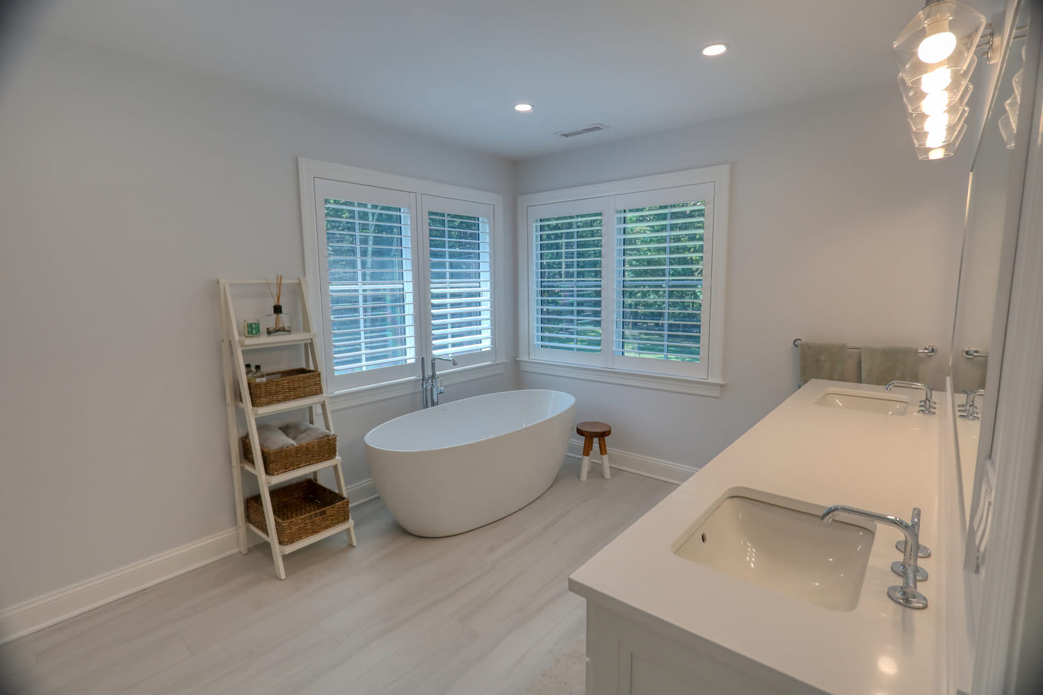 white soaking tub in modern farmhouse primary bathroom by raymond design builders in ct