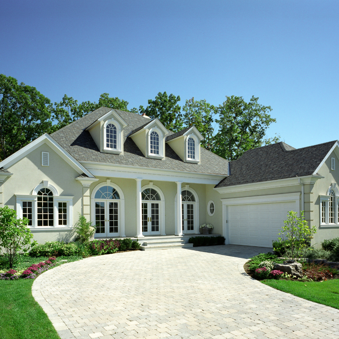 white house with white garage and driveway